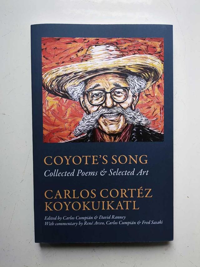 cover of coyotes song book, featuring a colourful painting of carlos cortez